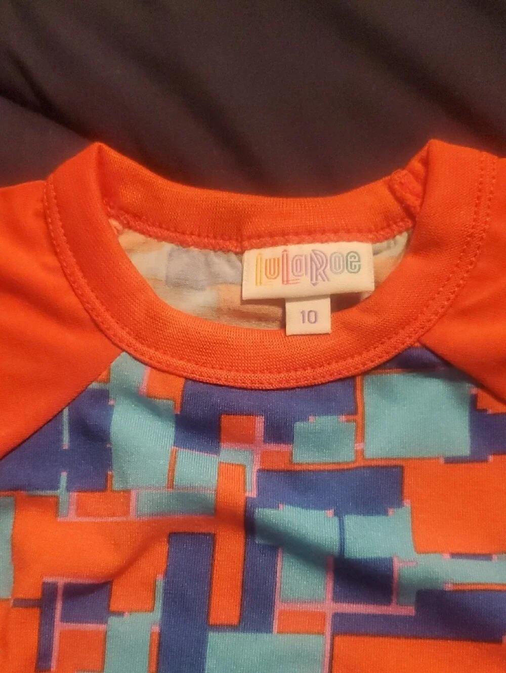 LuLaRoe Orange, Blue & Light Blue Geometric Raglan Tee